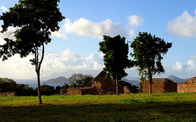 A crusher bucket and a screening bucket at work on a Caribbean island 