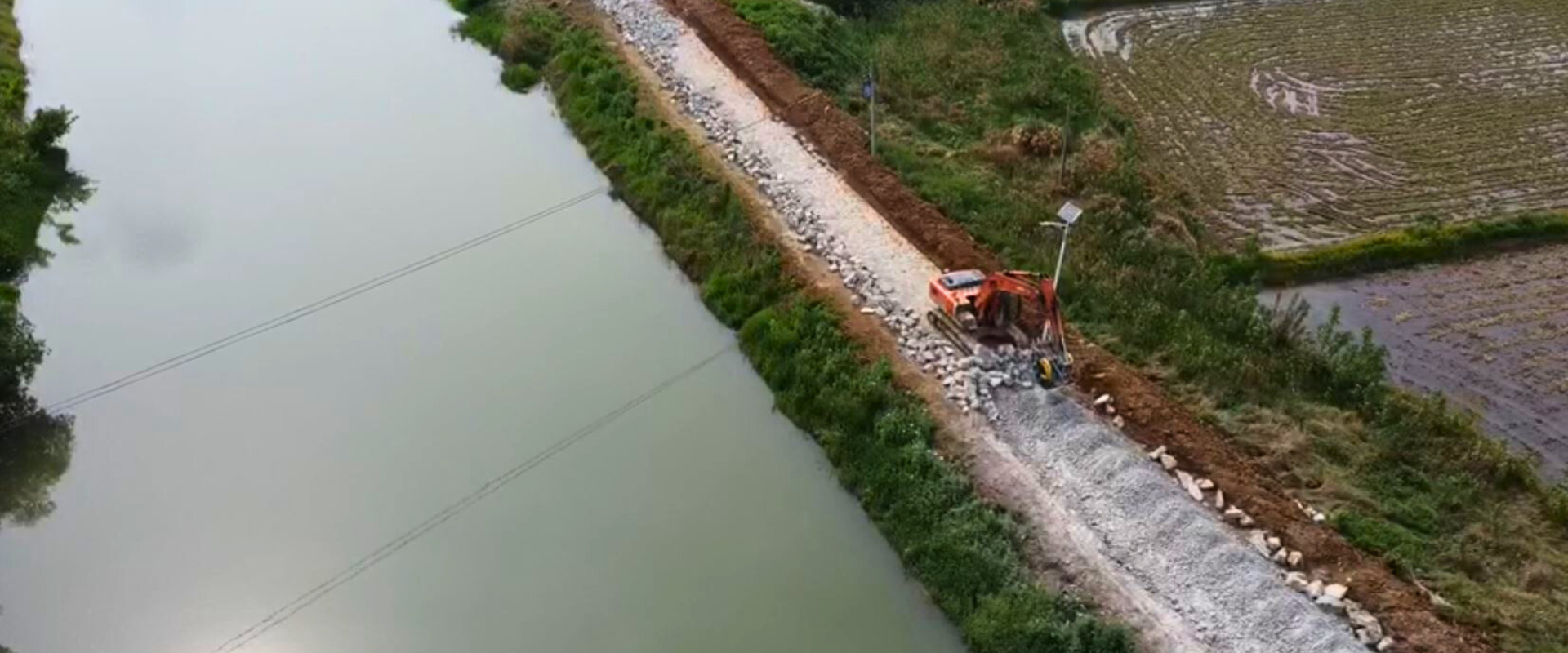 MB Crusher BF80.3 on Komatsu excavator creating reusable recycled aggregate from demolition waste.